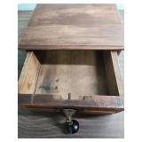 Antique Wood Box with ornate brass escutcheon and black wood drop pull handle.  Could be considered a small lap writing desk. 10.5" W x 11.25"D x  4.25" H