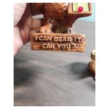 Two vintage Bear toothbrush holders and a vintage Bear thermometer that says "I can bear it, can you".  All are ceramic