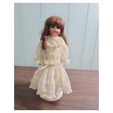 Antique German Made Bisque Doll in White Lace Dress with Ringlet Hair on stand - early 1900s