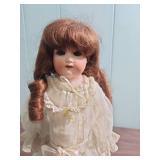 Antique German Made Bisque Doll in White Lace Dress with Ringlet Hair on stand - early 1900s