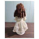 Antique German Made Bisque Doll in White Lace Dress with Ringlet Hair on stand - early 1900s