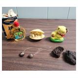 Miscellaneous Vintage items from Japan including 2 bottles of Oshima Tsubaki Camellia Oil, 2 lava rocks, plastic oyster scene, and more