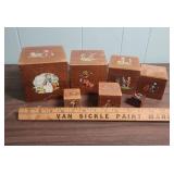 Mid-Century Wooden Nesting Blocks with Story Book Illustrations (one box has damage on top and is missing its scene)