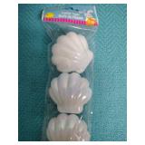 White Plastic Shell-Shaped Easter Egg Containers and a large plastic easter egg