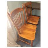 Two vintage solid Maple dining chairs with Spindle backs and turned legs. 18"W x 16.5" D x 38"H. Seat height 17".  Very good condition. Slight finish wear on top spindles of one chair