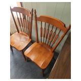Two vintage solid Maple dining chairs with Spindle backs and turned legs. 18"W x 16.5" D x 38"H. Seat height 17".  Very good condition. Slight finish wear on top spindles of one chair