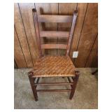 Vintage Wooden Ladder Back Chair with Woven Rotan Seat. Sturdy, good condition. 17.5"W x 13.5"D x 33.5"H. Seat height 17"