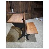 Antique American School Desk with Cast Iron Base and folding front chair. 22"W x 28"D x 30"H. Seat height 15". Desk height 26". Has finish wear and markings on the wood.