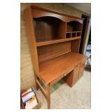 Wood laminate Computer Desk with Hutch. 57" 1/8 W x 23.5" D x 70"H. In the basement, hutch is removable for transport.  Very good condition.