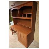 Wood laminate Computer Desk with Hutch. 57" 1/8 W x 23.5" D x 70"H. In the basement, hutch is removable for transport.  Very good condition.