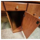 Wood laminate Computer Desk with Hutch. 57" 1/8 W x 23.5" D x 70"H. In the basement, hutch is removable for transport.  Very good condition.