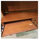 Wood laminate Computer Desk with Hutch. 57" 1/8 W x 23.5" D x 70"H. In the basement, hutch is removable for transport.  Very good condition.