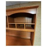 Wood laminate Computer Desk with Hutch. 57" 1/8 W x 23.5" D x 70"H. In the basement, hutch is removable for transport.  Very good condition.