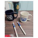 Phillips 66 Promotional Items - coffee mugs, travel mugs, ink pens, shot glass, and a zipper pouch.