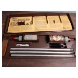 Outers Gun Cleaning Kit , a few vintage bullets, picket knife, and an acrylic keychain with an airplane inside