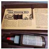 Outers Gun Cleaning Kit , a few vintage bullets, picket knife, and an acrylic keychain with an airplane inside