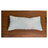 Decorative bed pillows in light blue/light turquoise - one has puffy checkerboard pattern, the other is a bolster pillow embellished with beads