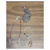 Vintage costume jewelry- 4 necklaces, one bracelet, a pendant, and 2 brooches