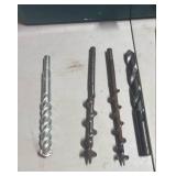 Small toolbox with large bits and hole saw bits