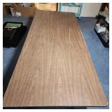 6 foot wood laminate top folding table - measures 72" L x 29.75" W x 29.25" H - has surface scratches and wear but very sturdy
