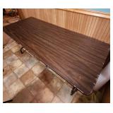 6 foot wood laminate top folding table - measures 72" L x 29.75" W x 29.25" H - has surface scratches and wear but very sturdy