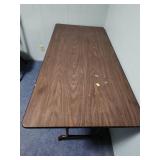 5 foot wood laminate top folding table - measures 60" W x 30" W x 29" H - has some paint splatters on it, but otherwise edges are in good condition and it is sturdy