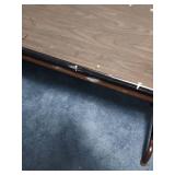 5 foot wood laminate top folding table - measures 60" W x 30" W x 29" H - has some paint splatters on it, but otherwise edges are in good condition and it is sturdy