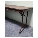 5 foot wood laminate top folding table - measures 60" W x 30" W x 29" H - has some paint splatters on it, but otherwise edges are in good condition and it is sturdy