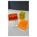 Lyman and other assorted orange and yellow plastic ammo cartridge boxes