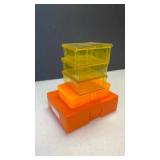 Lyman and other assorted orange and yellow plastic ammo cartridge boxes