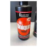 Alliant Powder Unique smokeless powder (both approximately 1/4 full)