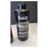 Alliant Powder Unique smokeless powder (both approximately 1/4 full)