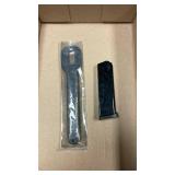 Leupold ring wrench with Smith & Wesson .45 magazine