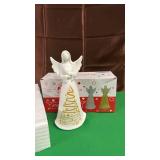Christmas Ceramic Angel,  Lights up, and comes with a Set of Replacement Batteries.