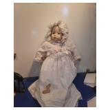 Porcelain Baby Doll in White Christening Gown stain on dress