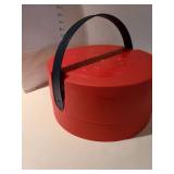 Tube paints in red storage caddy