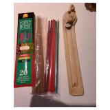 Incense burners with incense, plus a Christian Brothers brandy tin.