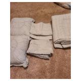 King-sized comforter, 2 pillow shams, 2 toss pillows and a bedskirt, very pale mint color