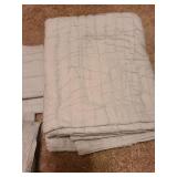 King-sized comforter, 2 pillow shams, 2 toss pillows and a bedskirt, very pale mint color