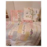 Full/Queen quilt, with 3 standard size pillow shams and a bed skirt.