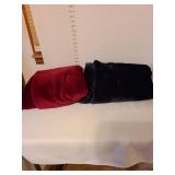 Navy blue and cranberry color throw blankets.