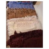 4 fringed throw blankets.