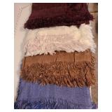 4 fringed throw blankets.