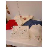 4 tablecloths and 3 napkins.