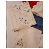 4 tablecloths and 3 napkins.