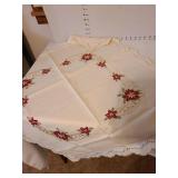 4 tablecloths and 3 napkins.