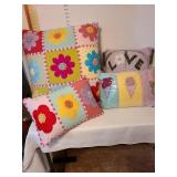4 decorative throw pillows. The Love pillow has small stains