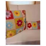 4 decorative throw pillows. The Love pillow has small stains