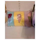 4 decorative throw pillows. The Love pillow has small stains
