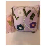 4 decorative throw pillows. The Love pillow has small stains